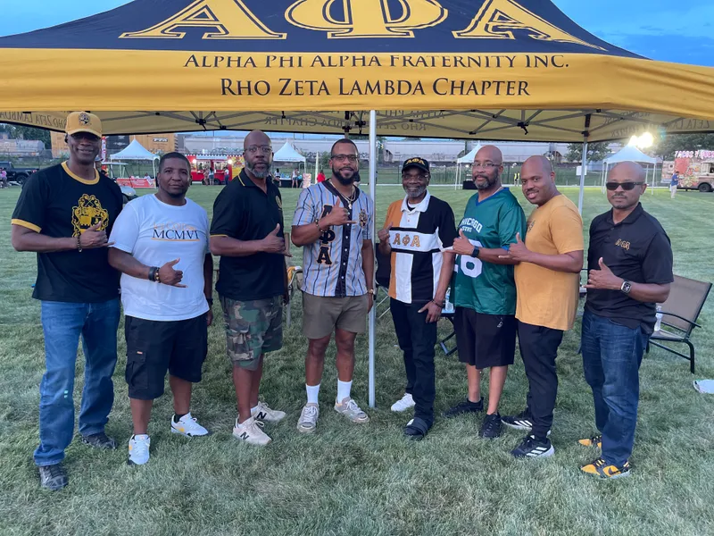 Group under the Alpha Phi Alpha Rho Zeta Lambda Chapter tent