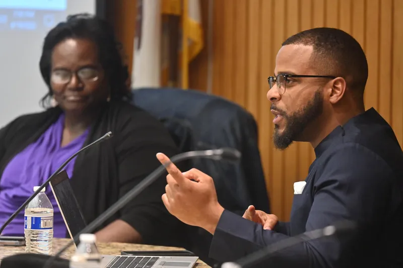Trustee Miguel Jones speaking at a Maywood board meeting