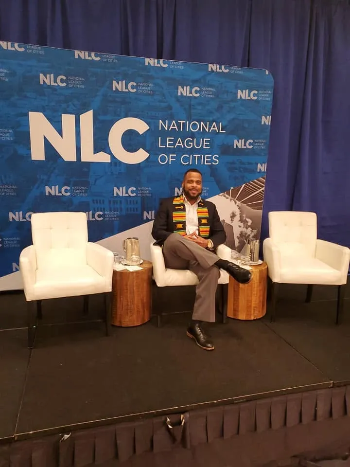 Miguel Jones on stage at a National League of Cities event